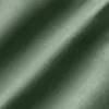 Close-up of green fabric texture with diagonal shadows, showcasing smooth and detailed textile pattern.