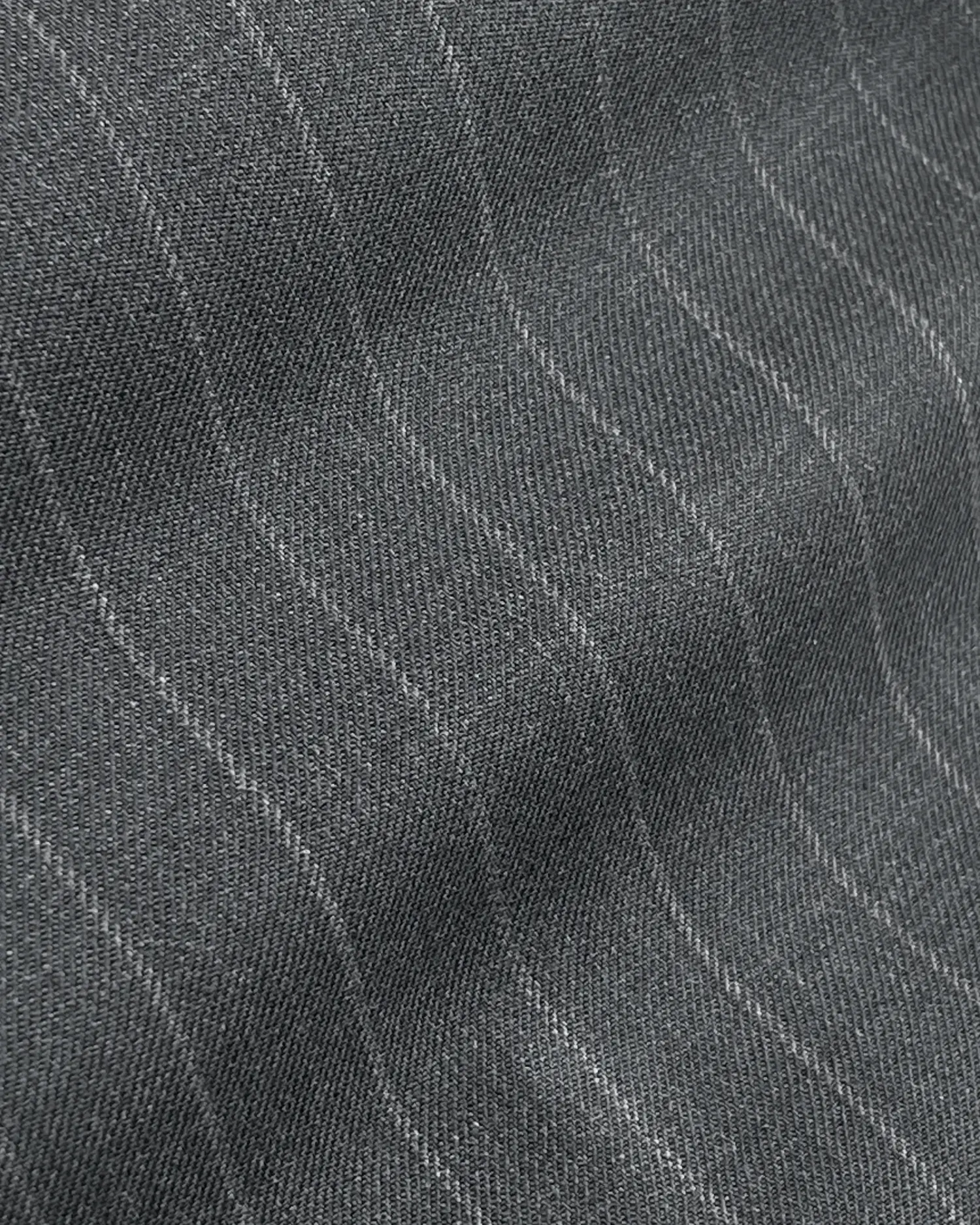 Close-up of gray pinstripe fabric texture with diagonal ridges, ideal for tailoring and fashion design inspiration.