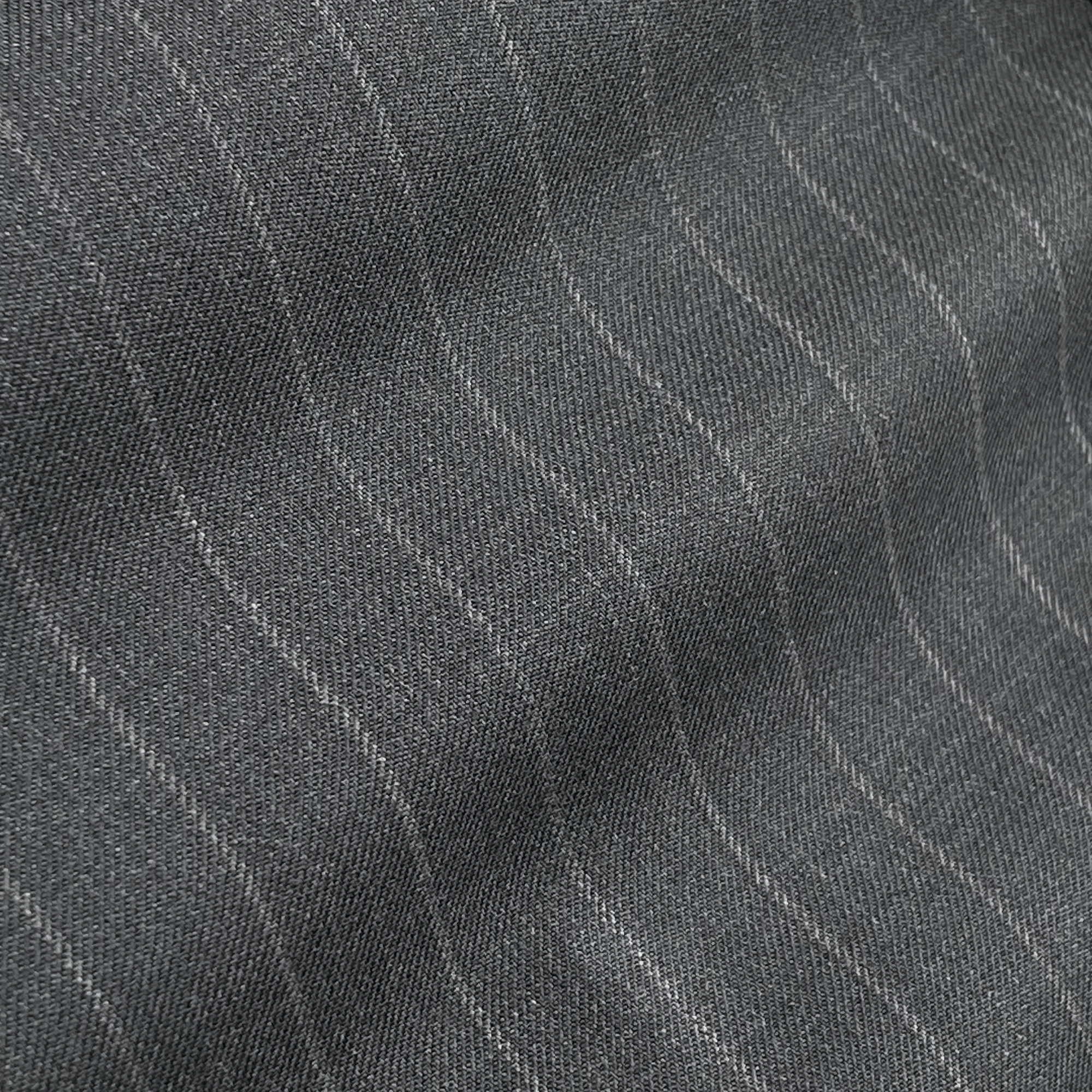 Close-up of gray pinstripe fabric texture with diagonal ridges, ideal for tailoring and fashion design inspiration.