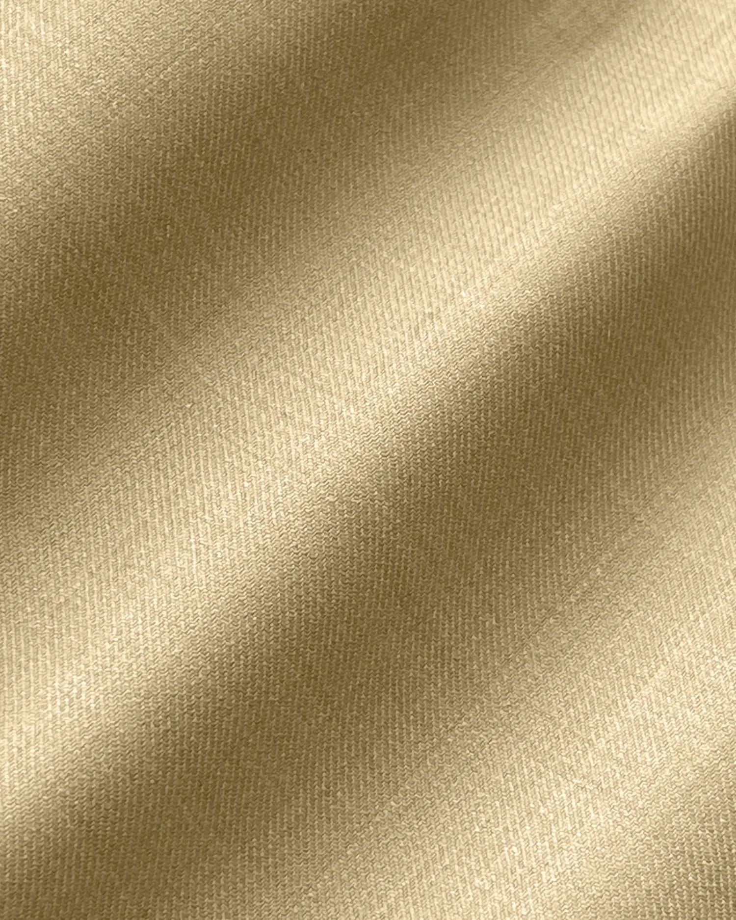 Beige textured fabric close-up with intricate weave pattern and soft light reflections.