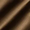 Close-up of luxurious brown fabric texture with soft lighting and diagonal shadows.