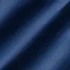 Close-up of textured blue denim fabric with soft shadows.