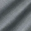 Close-up view of textured gray fabric with diagonal light and shadow patterns.