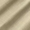 Beige textured fabric with subtle plaid pattern, showcasing soft and elegant textile material for fashion or upholstery.
