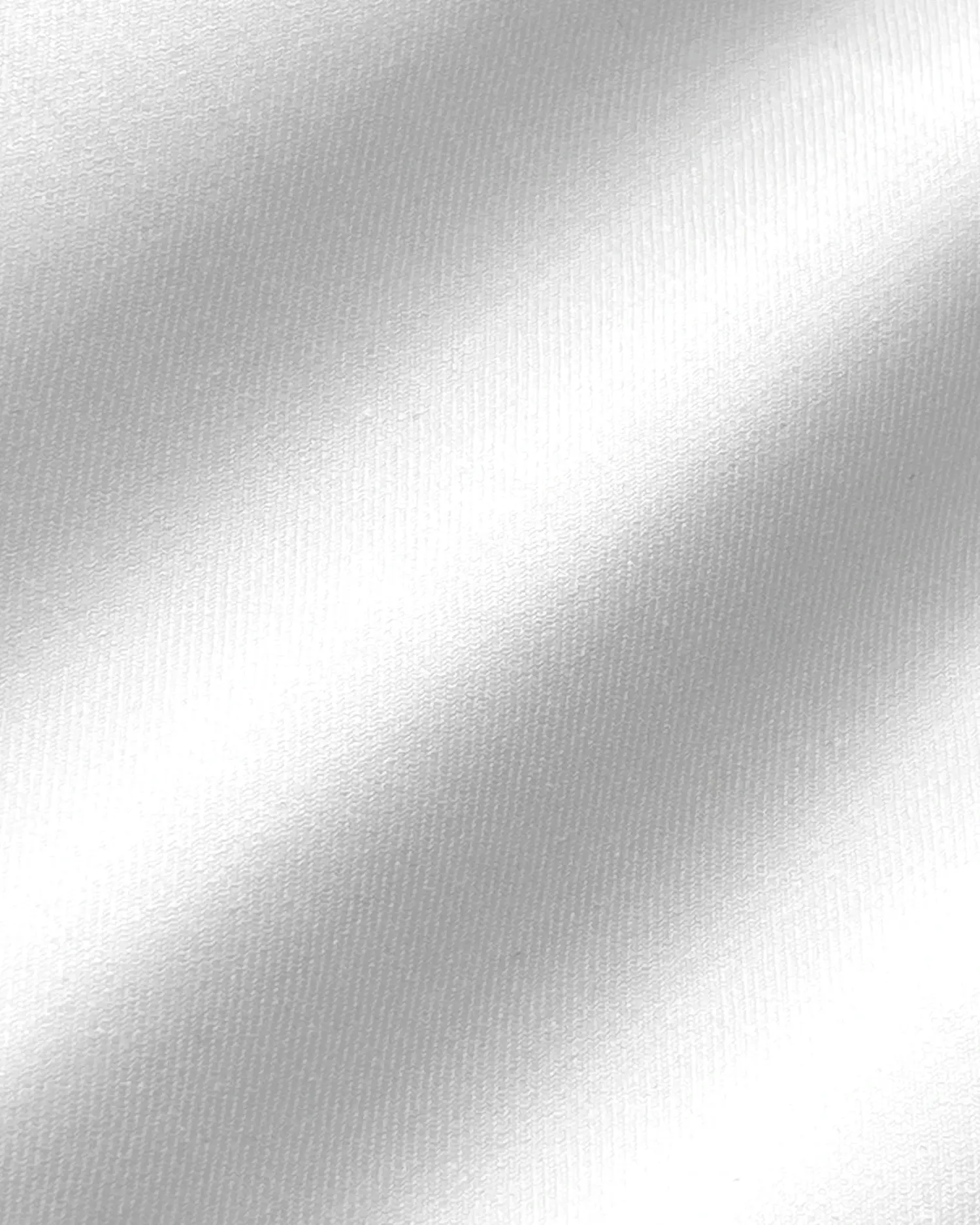 Smooth white fabric texture with a silky appearance, showcasing light and shadow patterns.