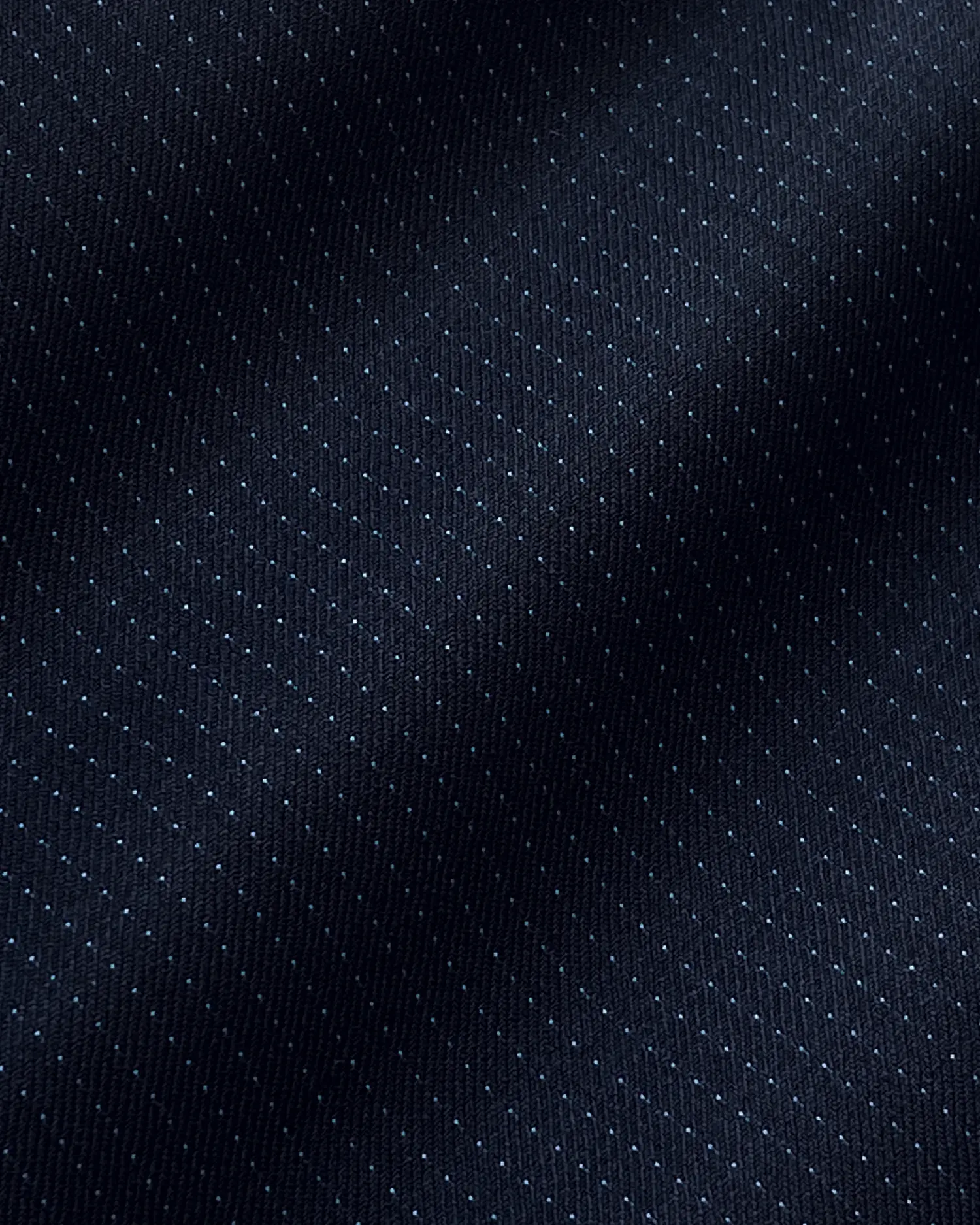 Dark blue textured fabric with subtle small dots creating a sleek, modern pattern.
