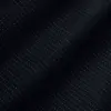 Dark textured fabric with subtle dotted pattern, creating an elegant and sophisticated design.