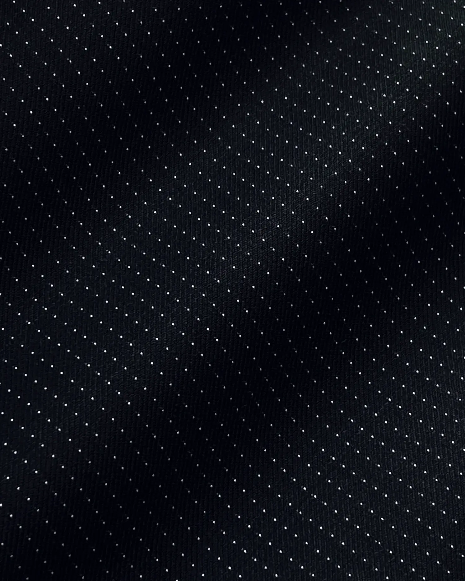 Dark textured fabric with subtle dotted pattern, creating an elegant and sophisticated design.