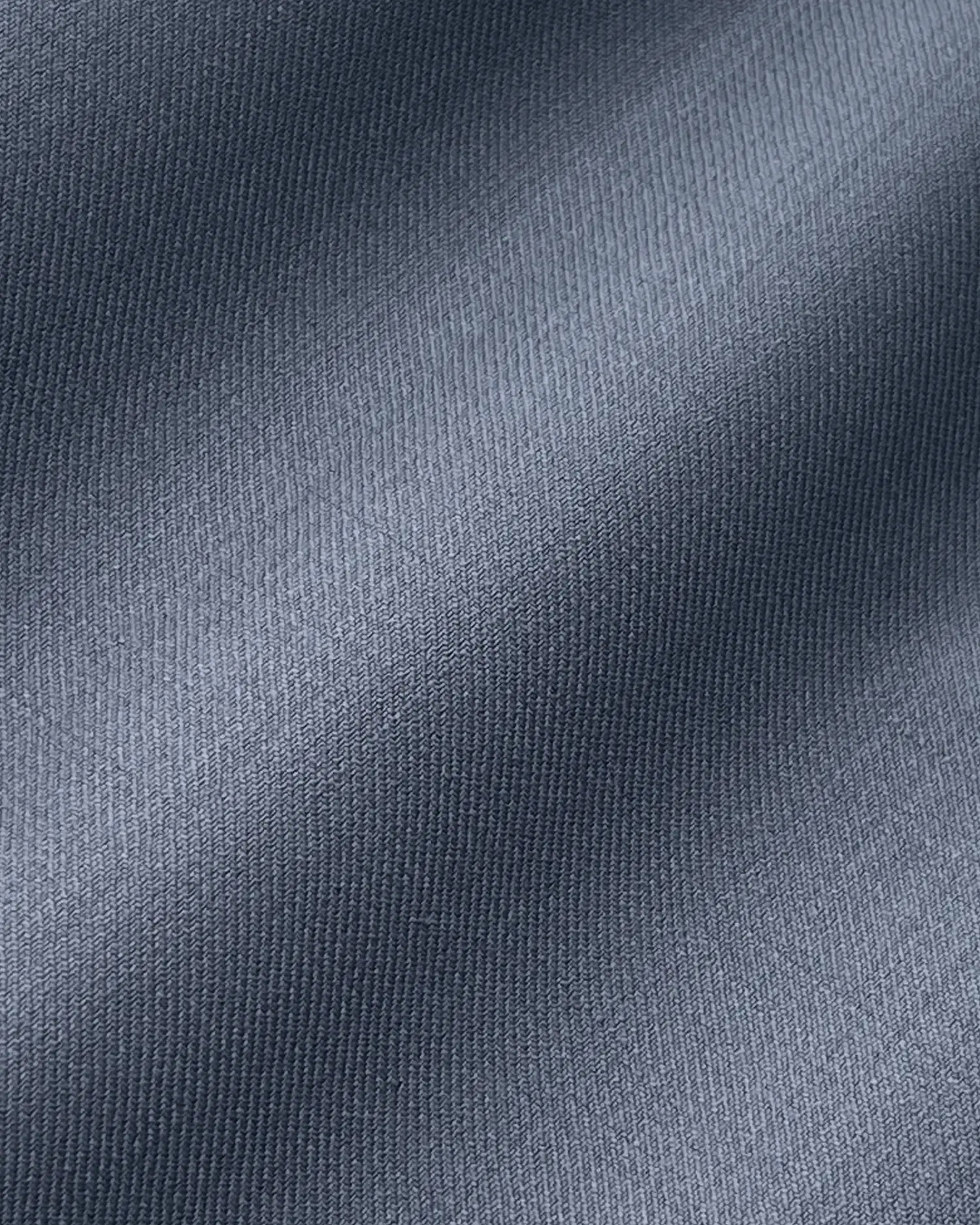 Gray fabric close-up with subtle textured pattern, ideal for fashion or interior design projects.