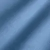 Smooth blue fabric texture with gentle shadows, ideal for textile and design backgrounds.