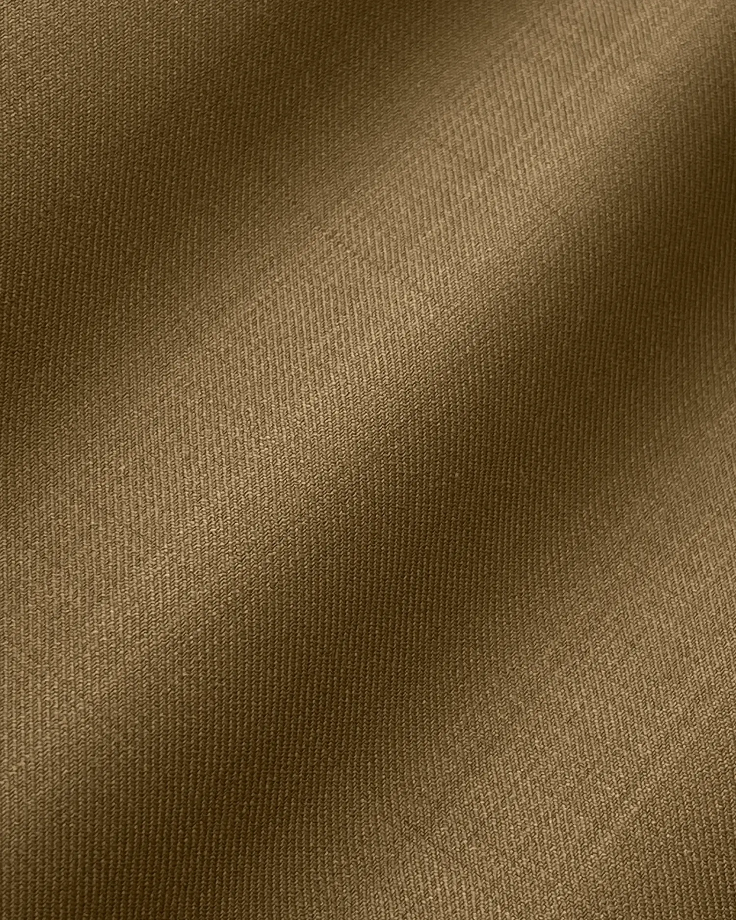 Close-up of brown fabric texture with detailed weave pattern.