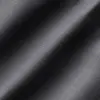 Close-up of smooth, dark fabric texture with subtle diagonal lines. Ideal for textile or fashion design concepts.
