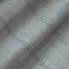 Close-up of gray textured fabric with subtle plaid pattern, ideal for upholstery or fashion design.
