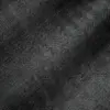 Close-up of black and white herringbone fabric texture with detailed zigzag pattern.