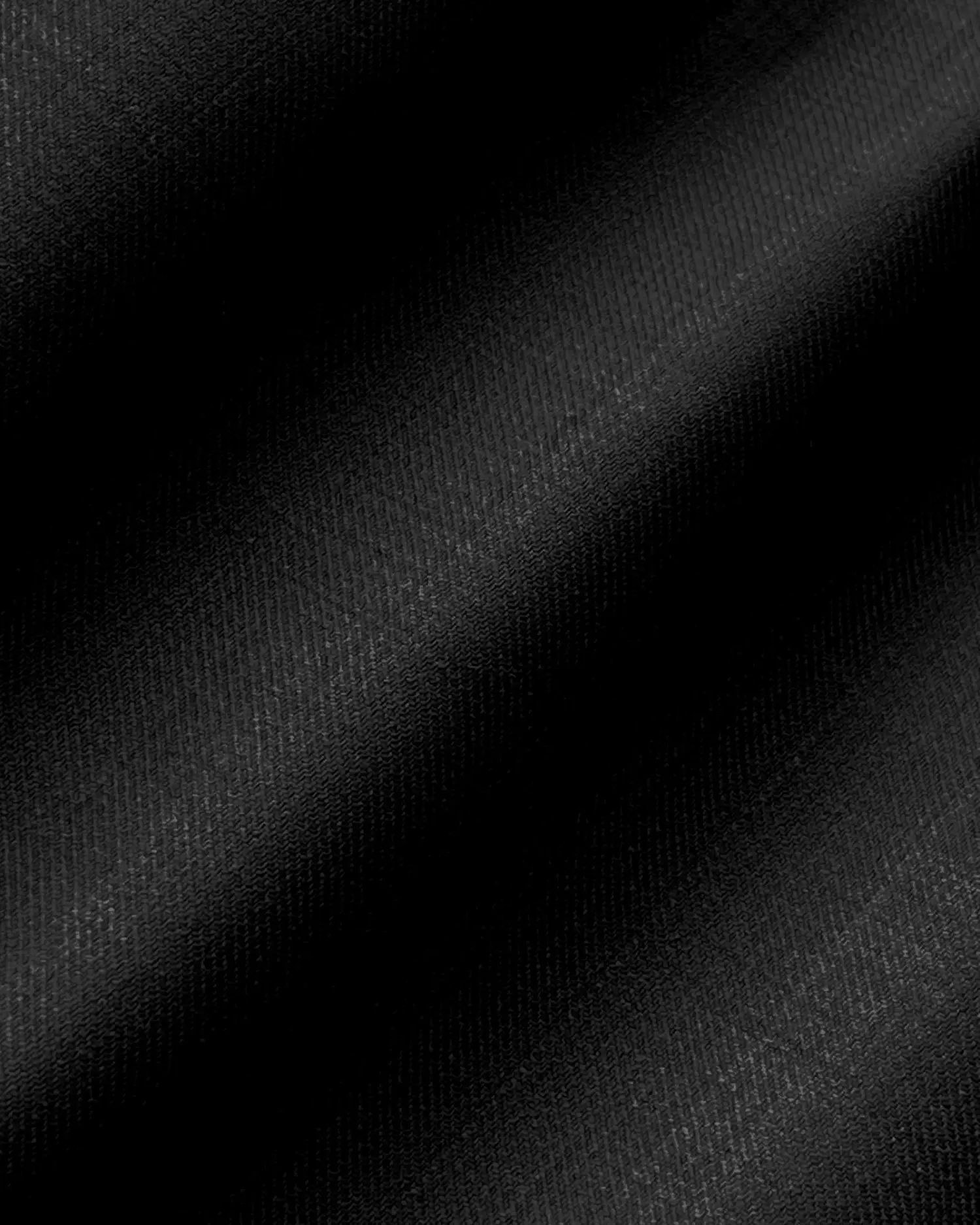 Smooth black fabric texture with subtle diagonal pattern, ideal for backgrounds or textile designs.