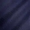 Close-up of a dark blue herringbone fabric texture, showing detailed pattern and weave.