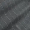 Close-up of gray pinstripe fabric with subtle wave texture, ideal for suiting and professional attire.