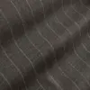 Close-up of a gray pinstripe fabric pattern, showcasing fine textured details and vertical lines for a tailored look.