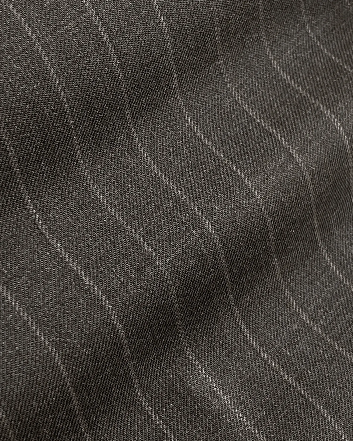 Close-up of a gray pinstripe fabric pattern, showcasing fine textured details and vertical lines for a tailored look.