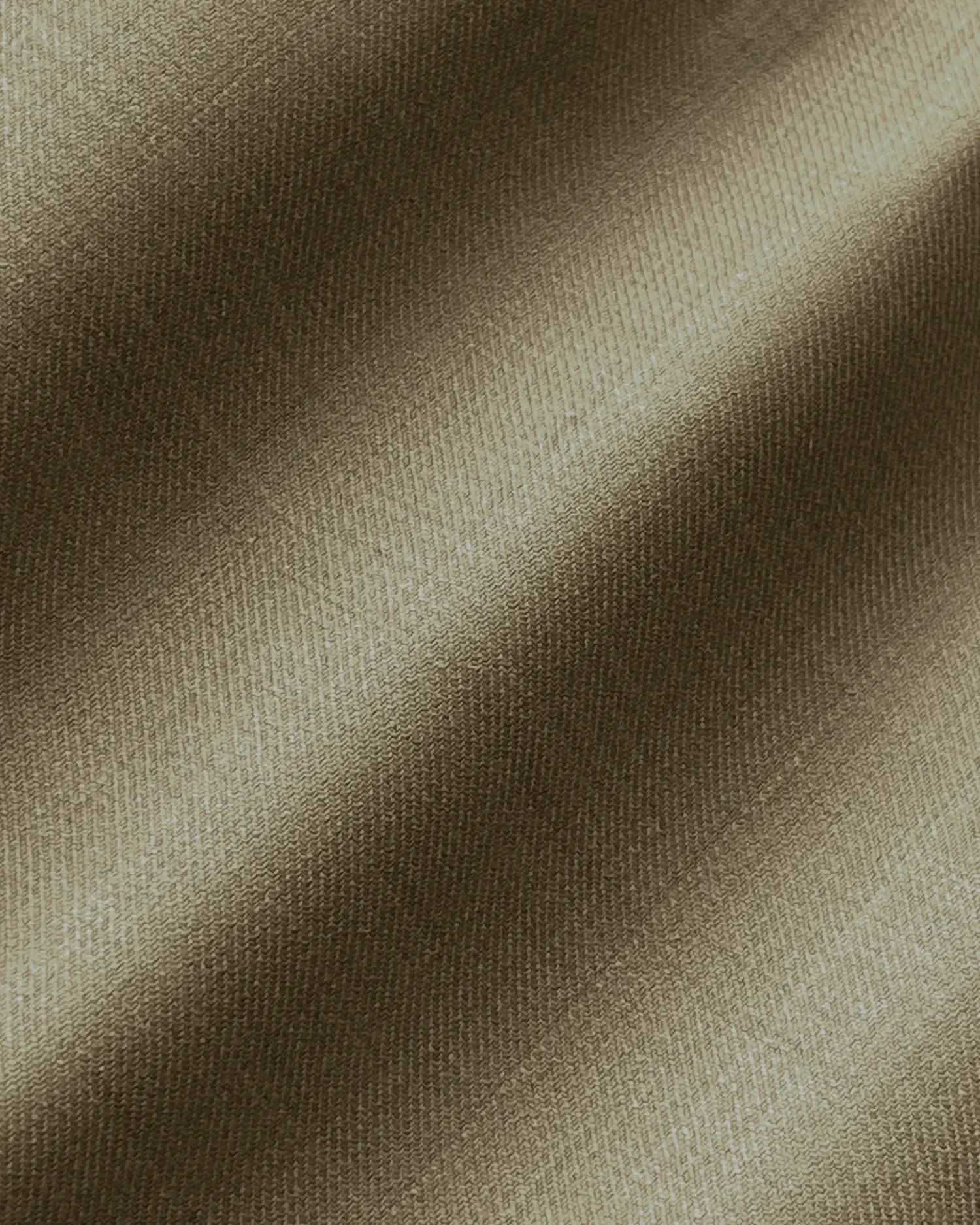 Textured brown fabric with diagonal weave pattern, creating a smooth and elegant appearance.