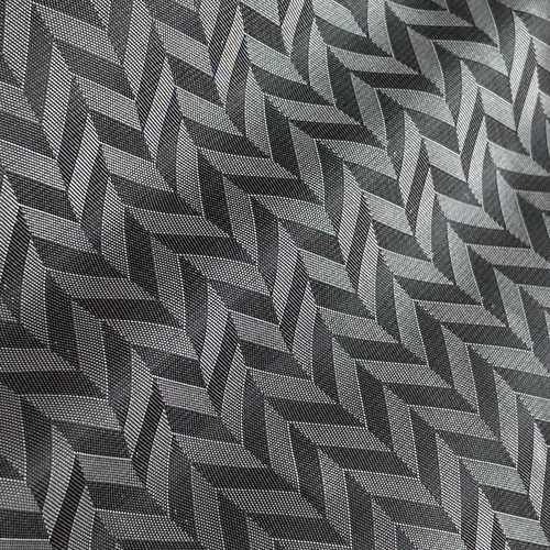 Gray geometric herringbone pattern on fabric, creating a textured, modern design ideal for decor or fashion.