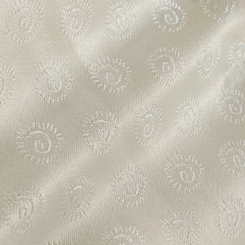 Elegant white Paisley pattern on textured fabric, highlighting intricate woven details and refined style.