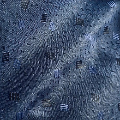 Blue patterned fabric with geometric shapes, featuring a mix of rectangles and squares for a textured appearance.