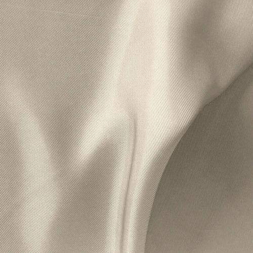 Close-up of beige fabric texture showcasing gentle folds and subtle sheen, ideal for textile or fashion design.