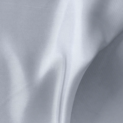 Close-up of smooth, grey satin fabric with soft folds and subtle texture. Ideal for fashion and textile references.