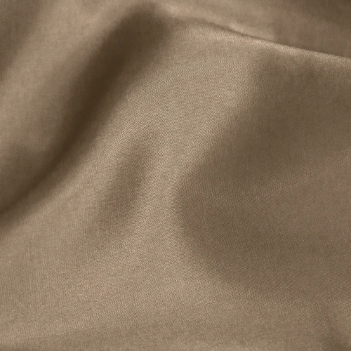 Close-up of smooth brown fabric with subtle folds and texture, ideal for upholstery or fashion design projects.