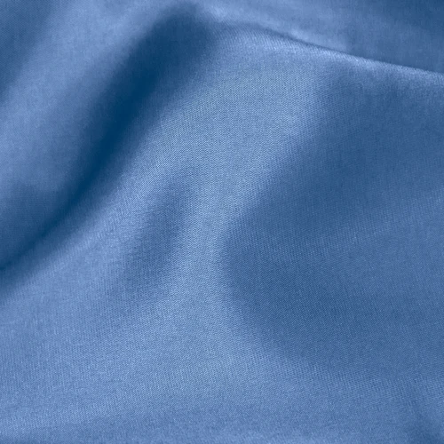 Smooth blue fabric texture, ideal for fashion, textiles, or interior design inspirations.