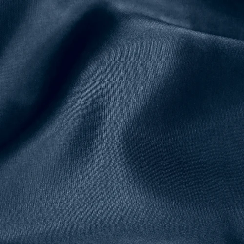 Dark blue fabric with soft folds, showcasing a smooth texture and elegant drape. Perfect for luxurious interior decor.
