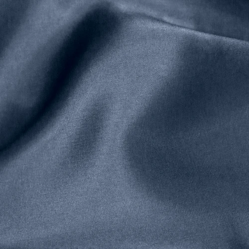 Close-up of smooth blue fabric texture with soft folds, ideal for textile and material backgrounds in design projects.