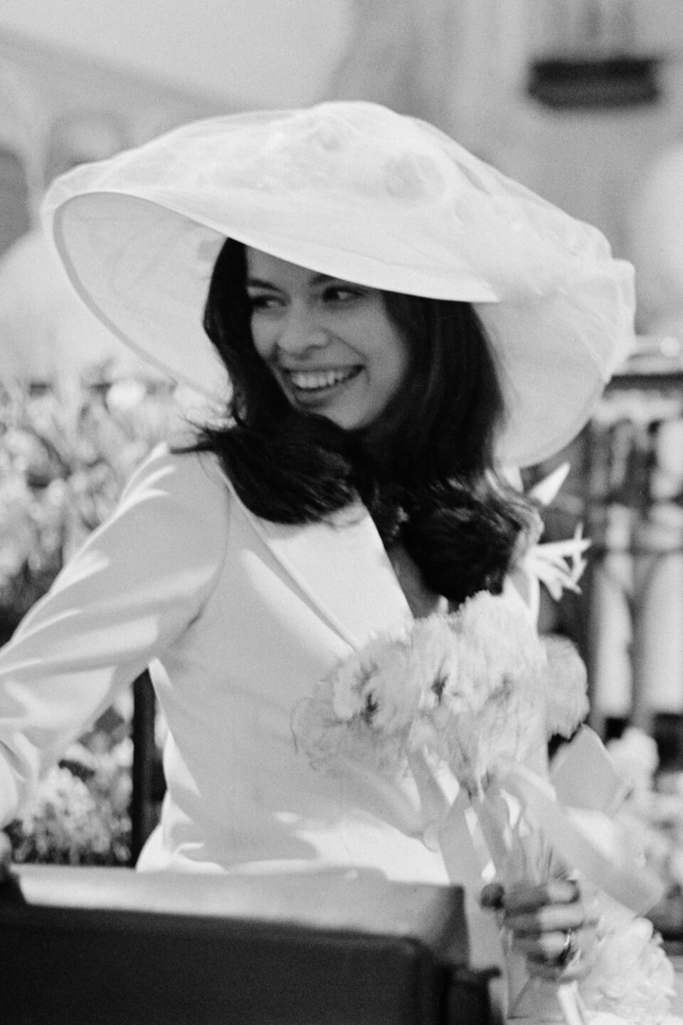 Bianca Jagger wedding suit 1971 St Tropez Tommy Nutter white skirt suit women in menswear history