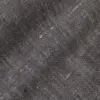Close-up of black tweed fabric texture with subtle white specks, perfect for fashion or interior design inspiration.
