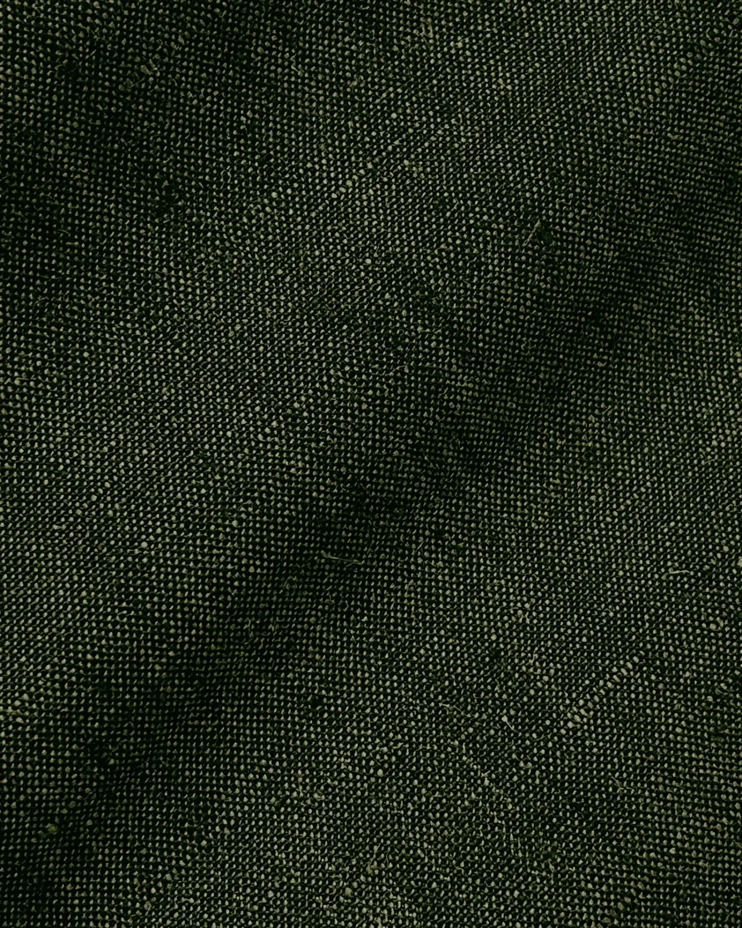 Dark green textured fabric close-up, showcasing intricate woven pattern and detailed surface texture.
