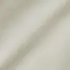 Close-up of cream herringbone fabric texture, showcasing detailed woven pattern for textiles and upholstery design.