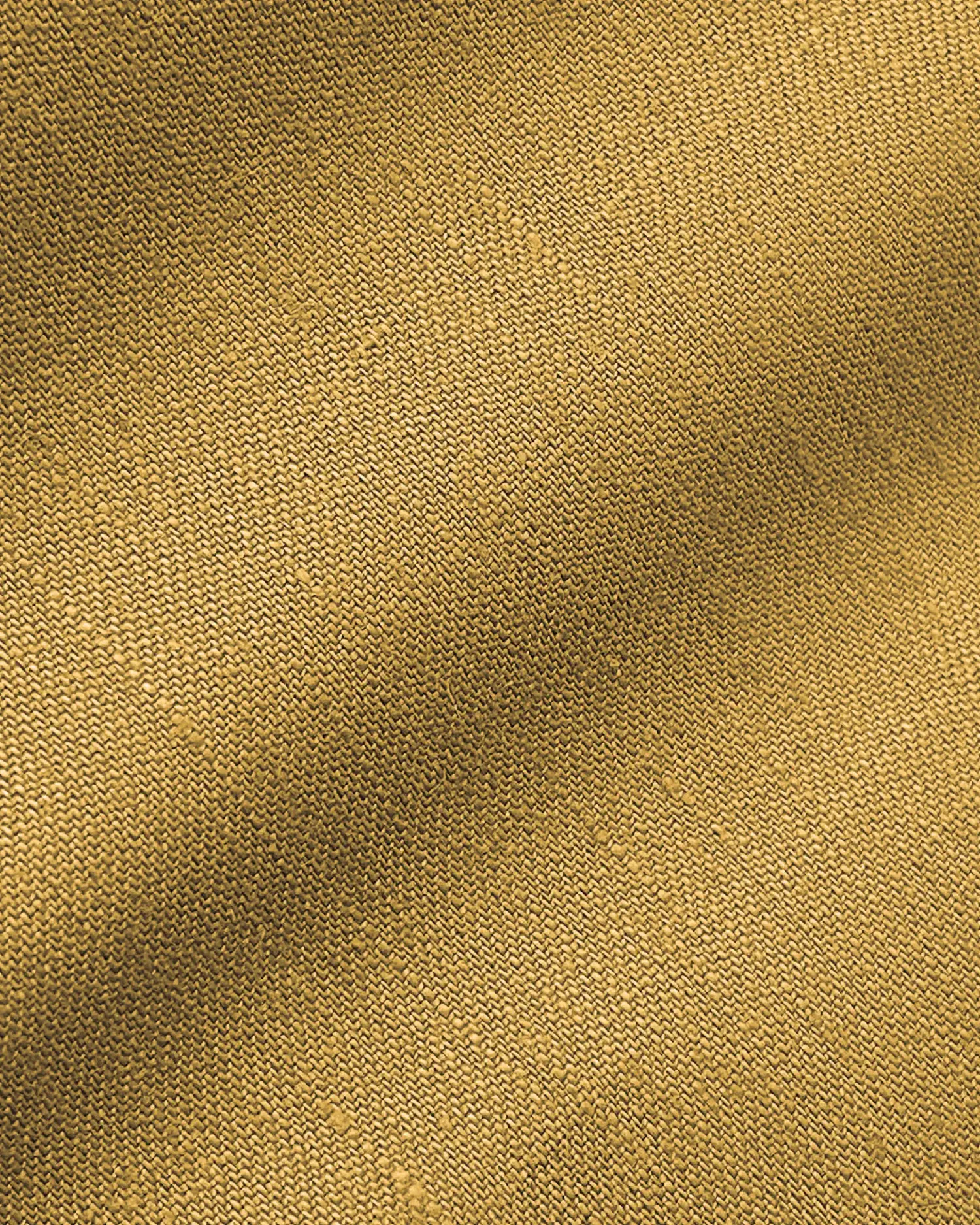 Close-up of brown textured fabric, showcasing fine woven pattern with subtle shadows and highlights.