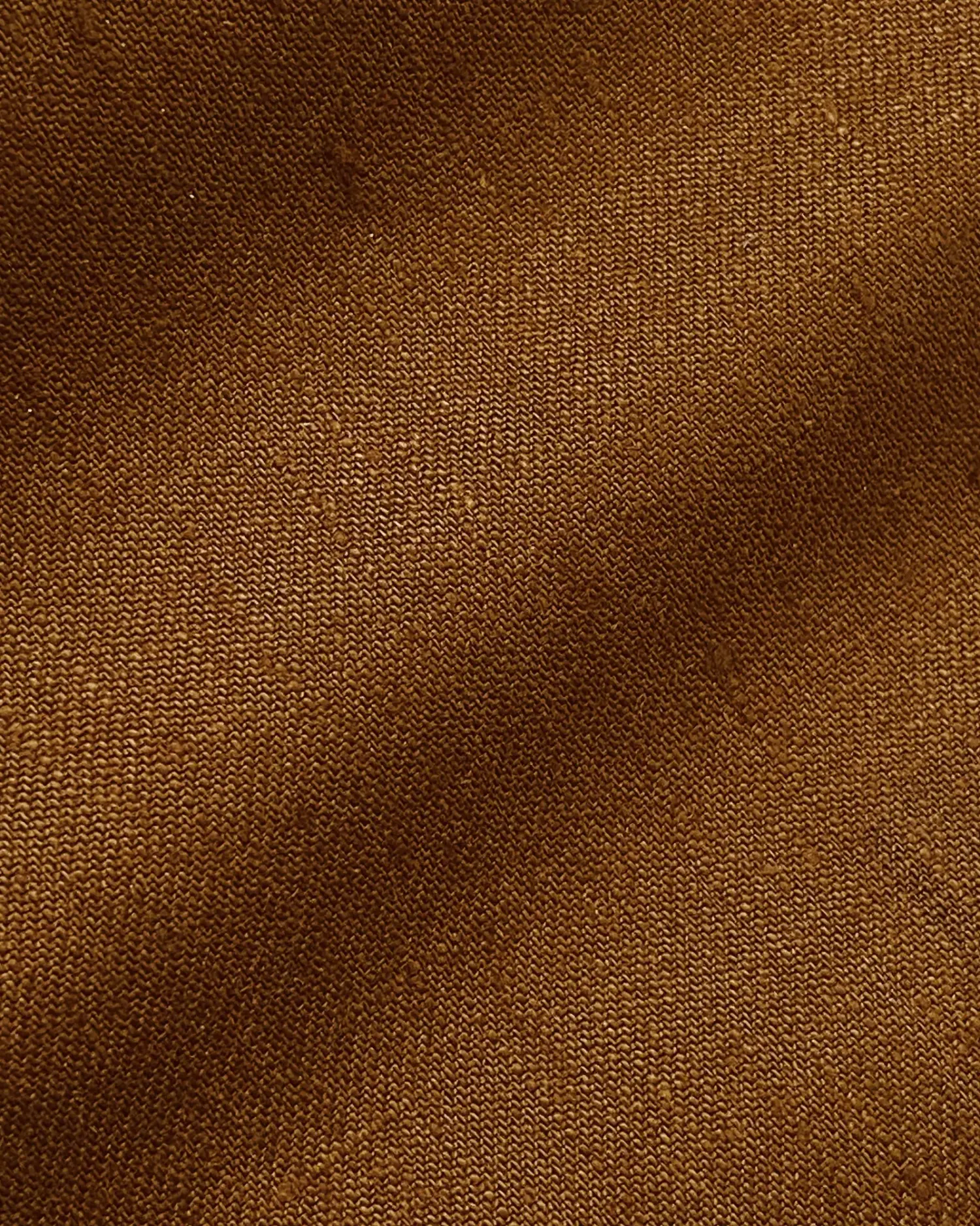 Close-up of brown textured fabric with visible weave pattern. Ideal for textiles, clothing, or upholstery designs.