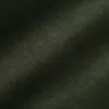 Close-up of dark green textured fabric with visible weave pattern.