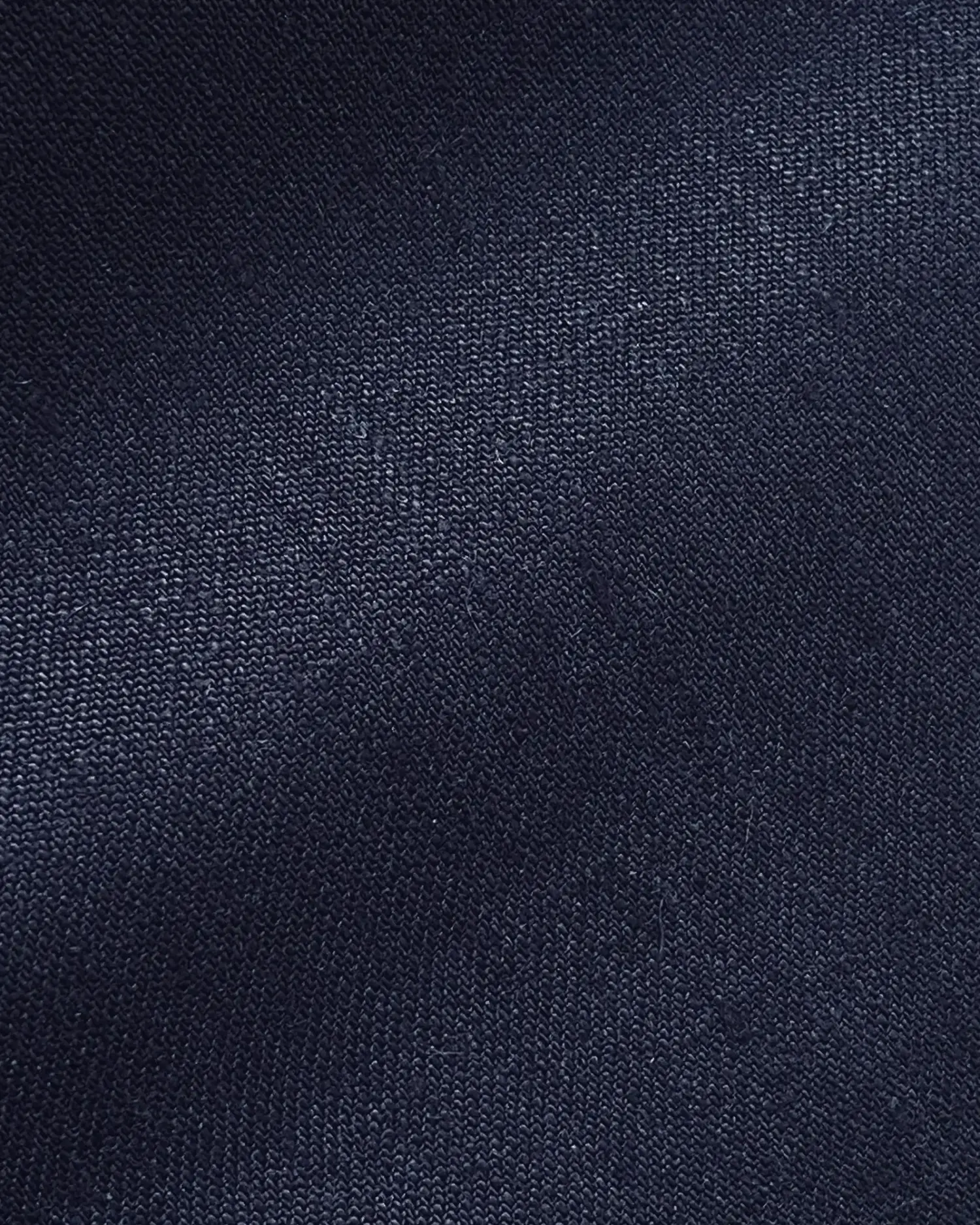 Dark blue fabric close-up with visible texture and weave pattern for textile design inspiration.