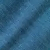 Close-up of blue textured fabric with detailed woven pattern.
